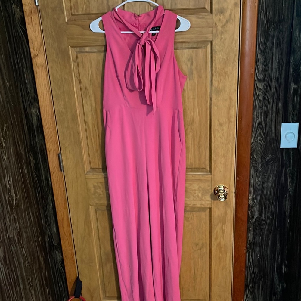 Pink jumpsuit with tie neck